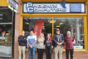 Father and son team lead Phoenix Computers’ next chapter, backed by a passionate local crew. From left to right: Deus, James, Katie, Brooklynn, Shawn, Jim.